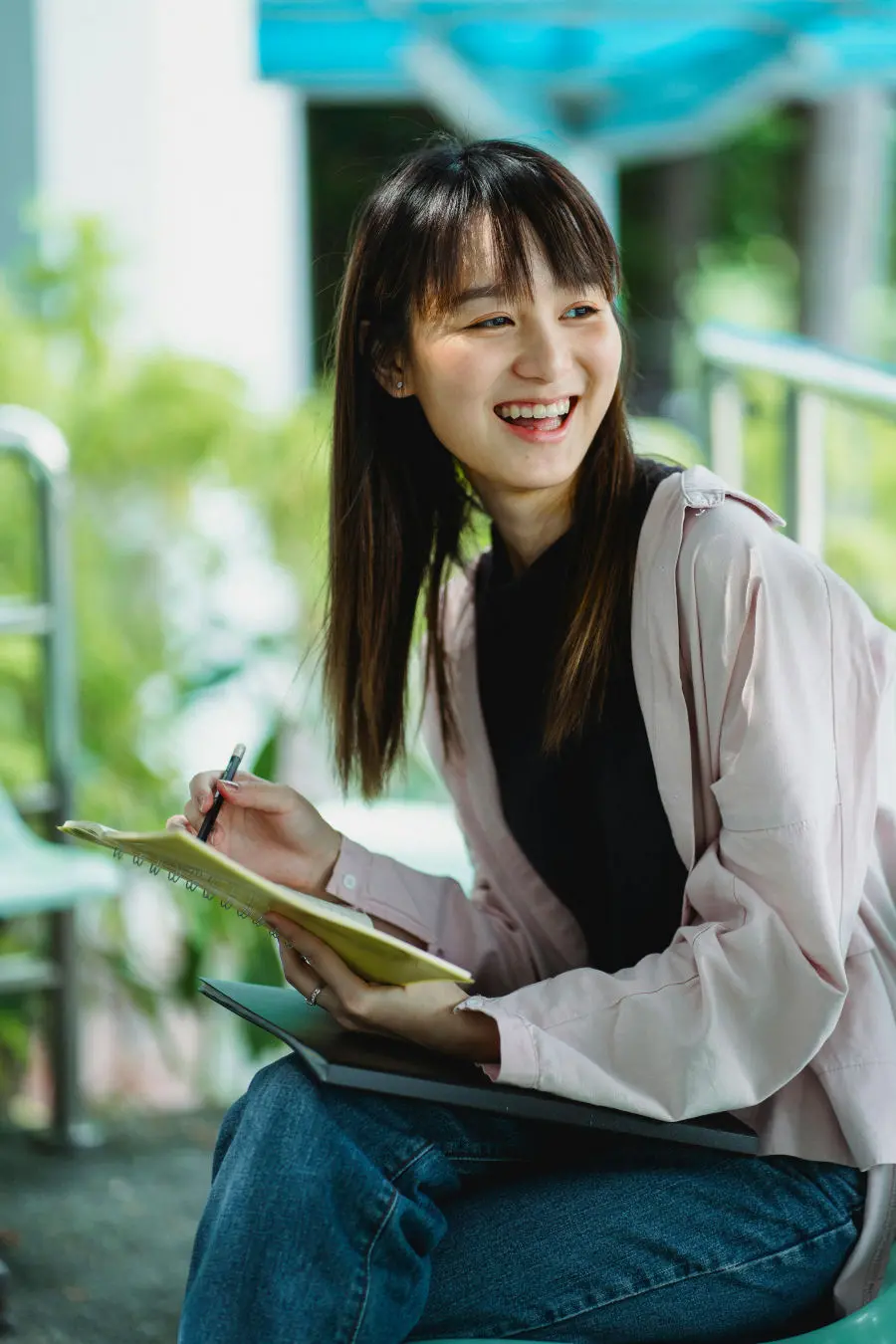 Woman smiling with a book