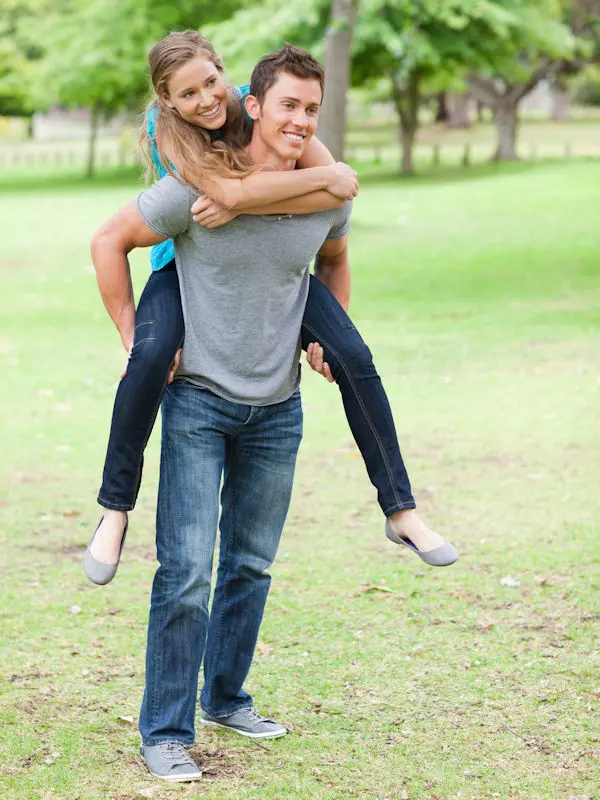 Woman being carried by a man