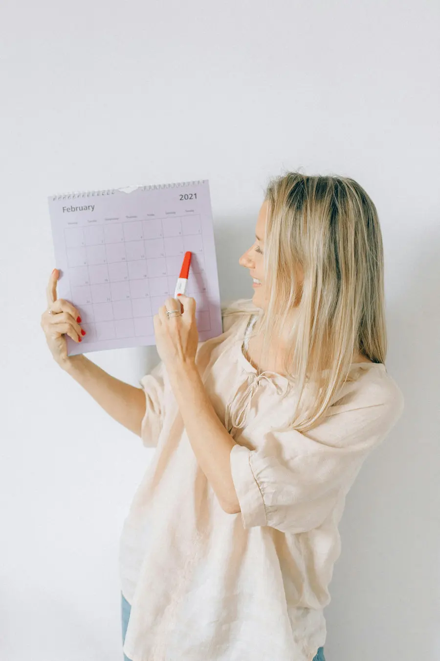 Woman with pregnancy planning chart